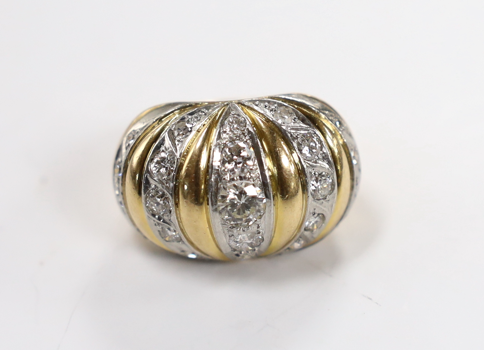 A yellow metal and diamond set five row line cluster set dress ring, size O, gross weight 17.7 grams.